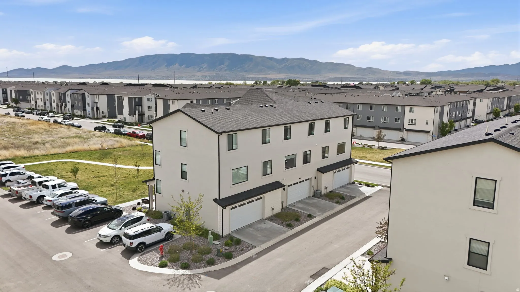 Aerial view of residential area featuring a mountain backdrop