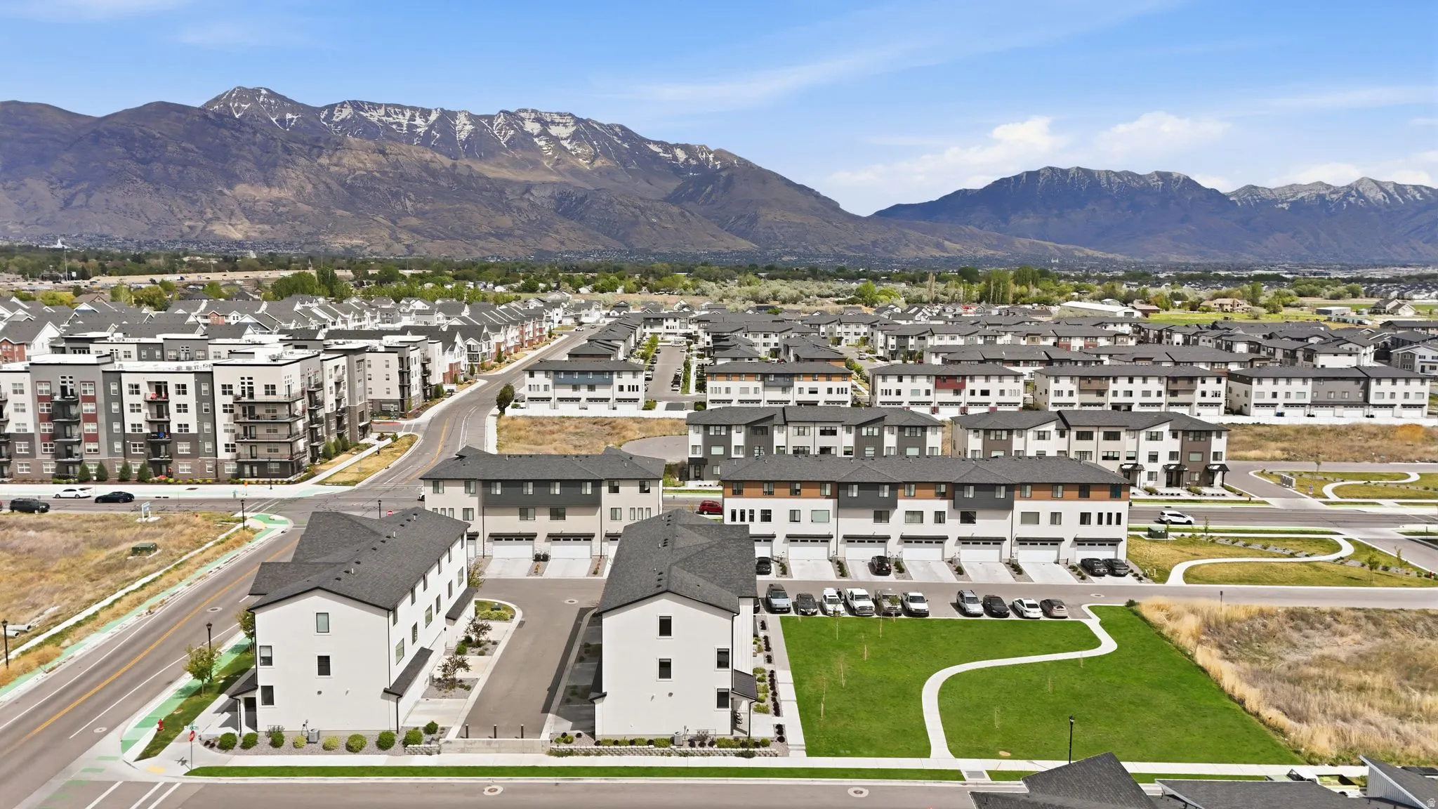Aerial perspective of suburban area with a mountainous background
