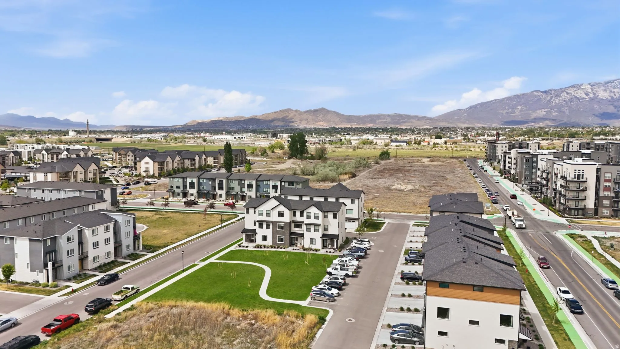 Aerial view of residential area featuring mountains