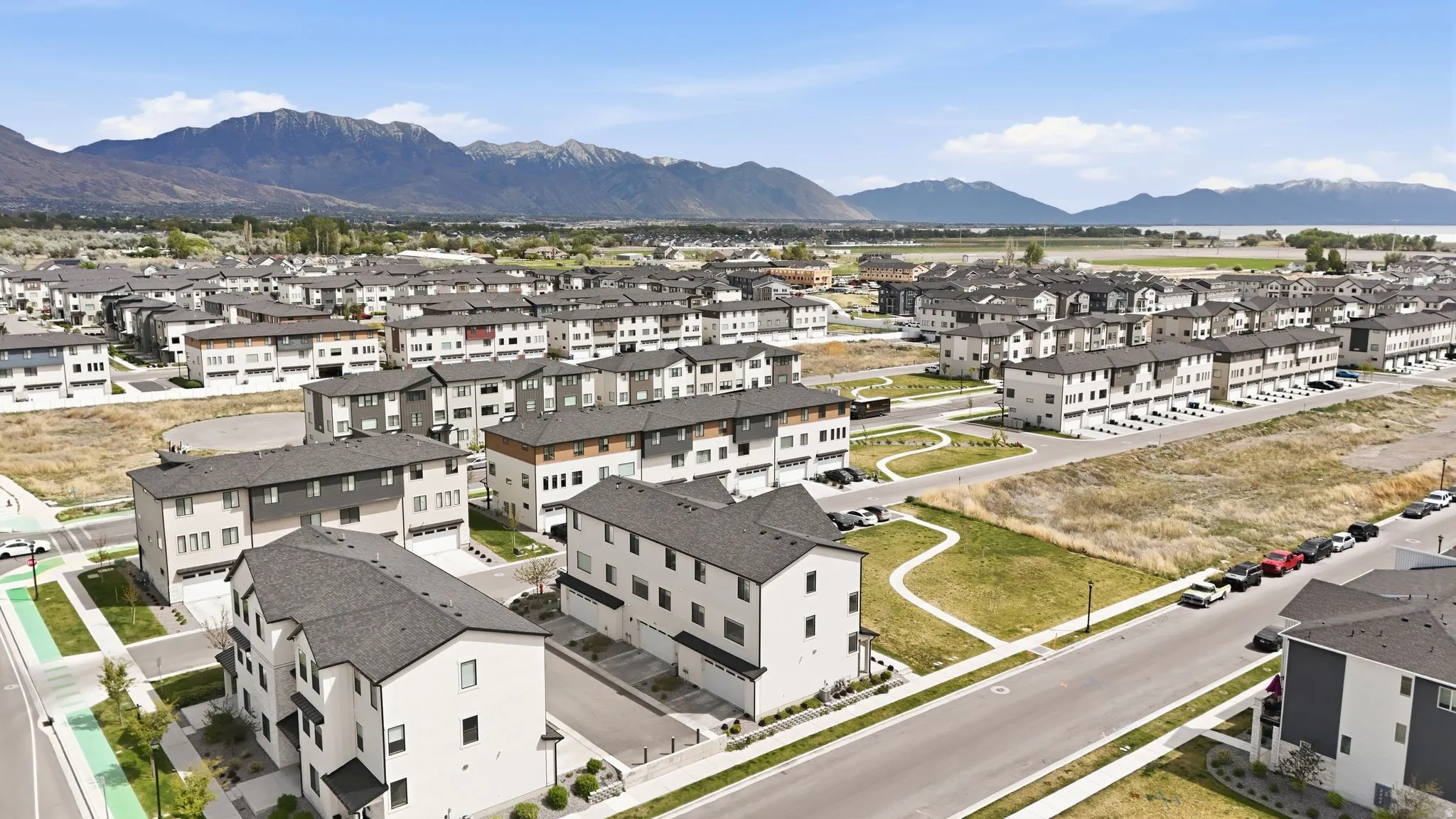 Aerial view of residential area featuring a mountainous background