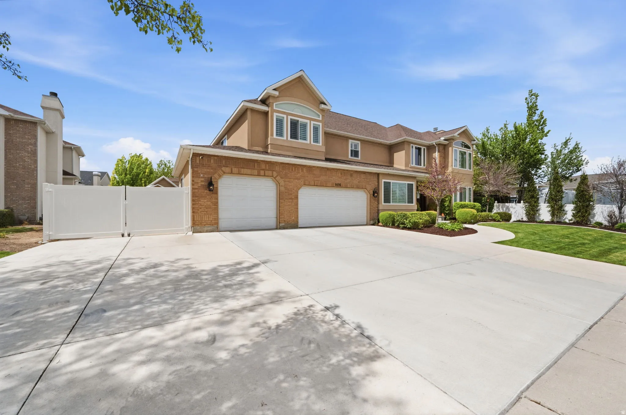 Front view with RV parking, new driveway and entry sidewalk