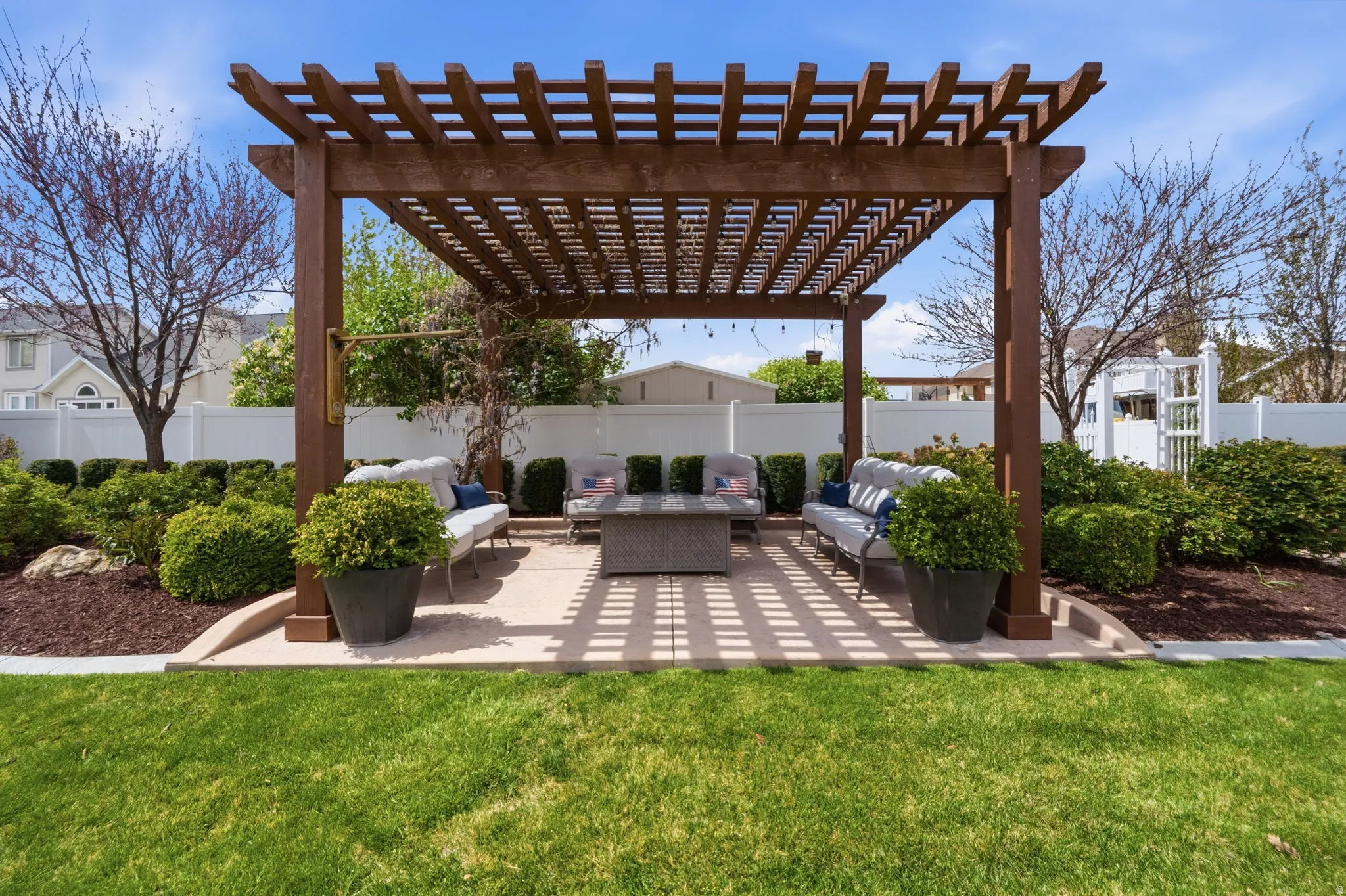 Fenced backyard featuring a pergola, outdoor lounge area, and a patio area