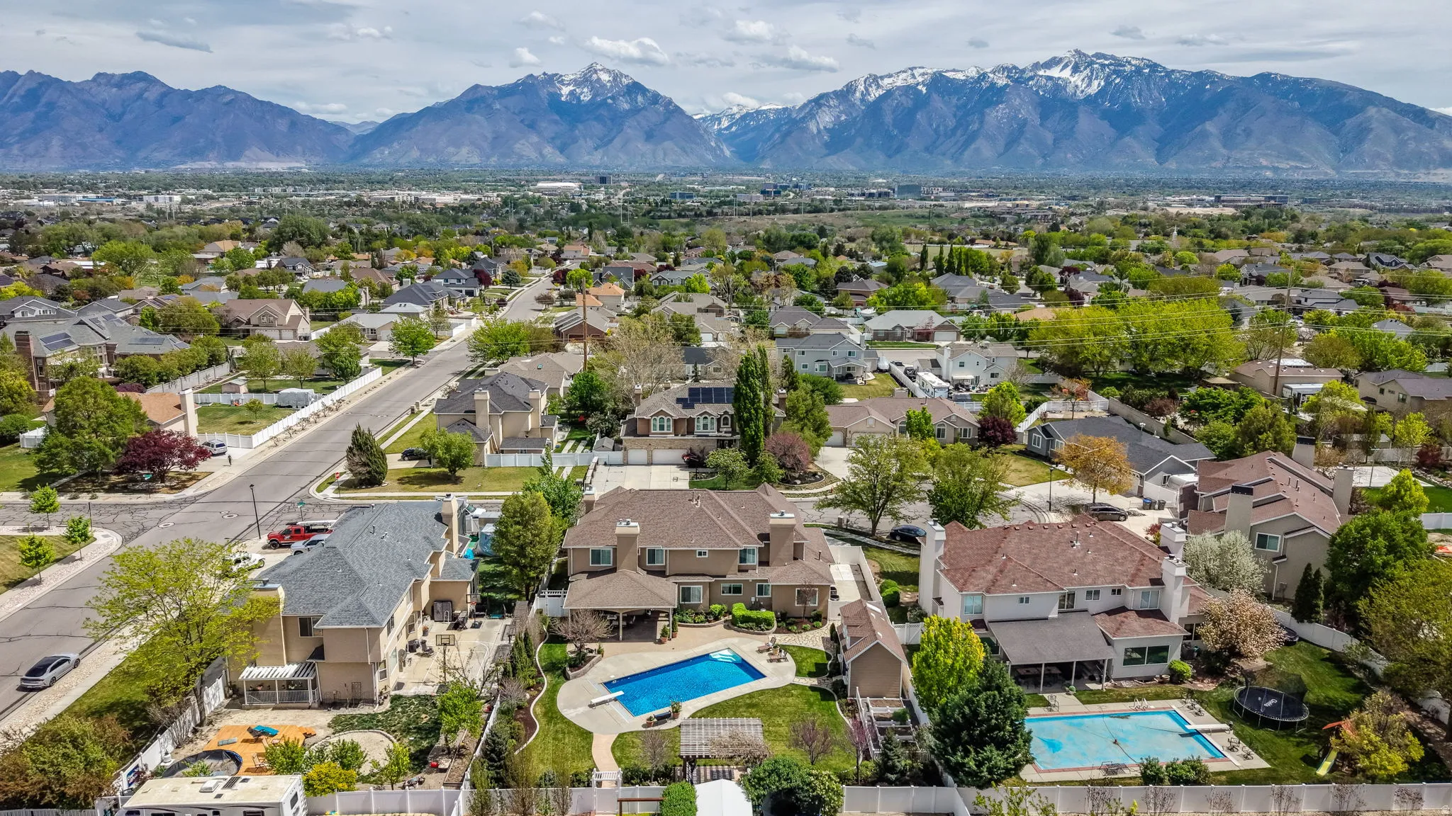 Aerial view of neighborhood featuring the Wasatch Front mountains