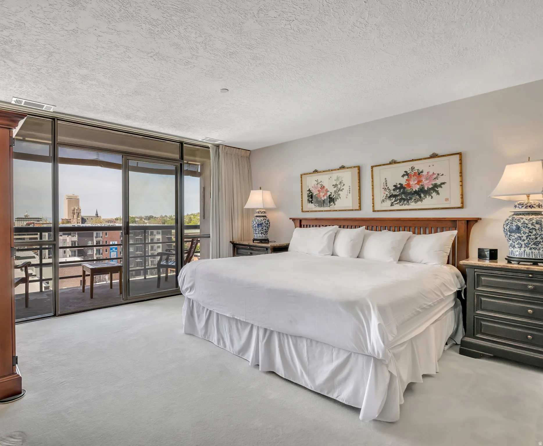 Large main bedroom with western city views and private 70 sf balcony