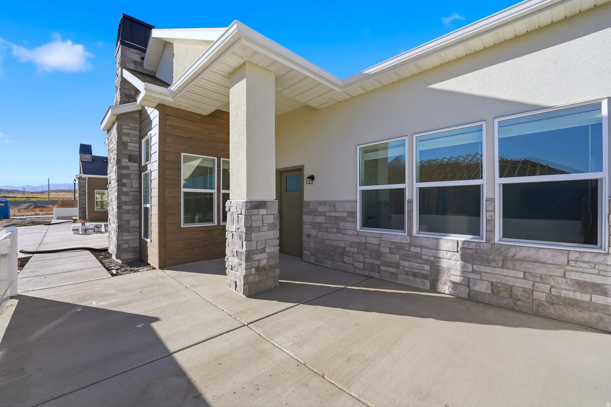 Partially fenced front patio