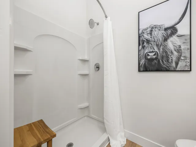 Primary bedroom en' suite with double vanity and walk in shower
