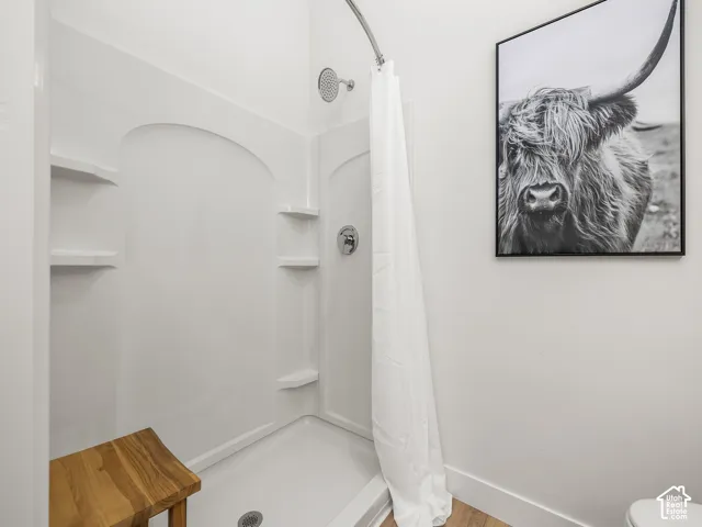 Primary bedroom en' suite with double vanity and walk in shower