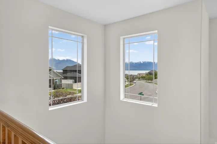 Two large windows showcase mountain and lake scenery