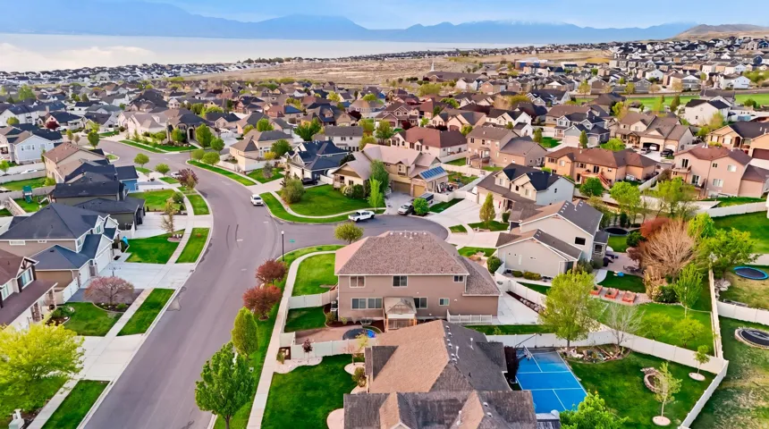 Aerial view of residential area with a mountainous background