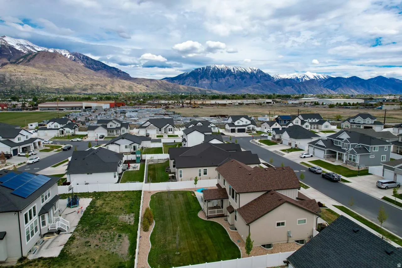Aerial perspective of suburban area with a mountain backdrop