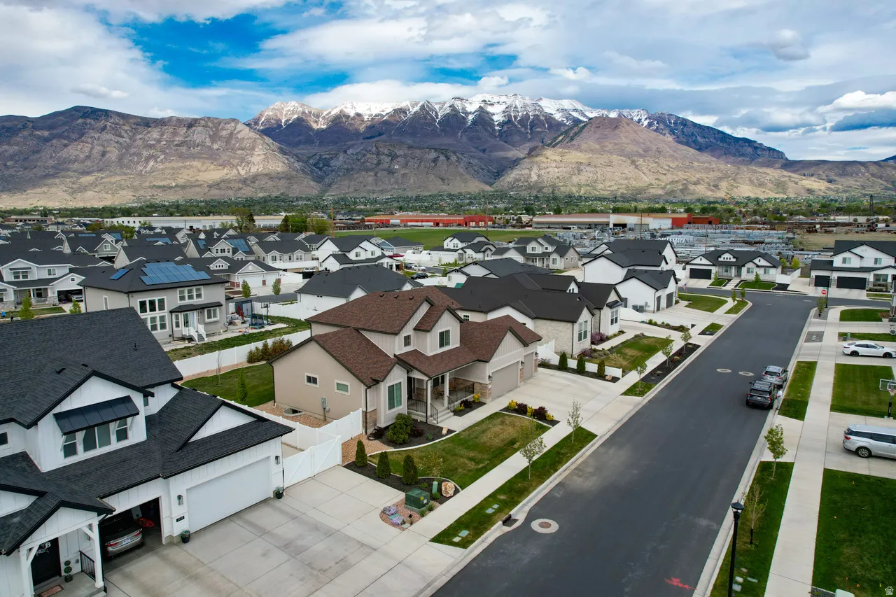 Aerial perspective of suburban area featuring a mountain backdrop