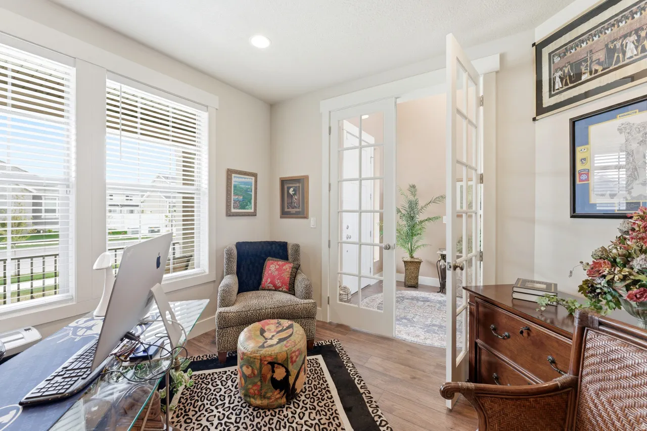 Sitting room featuring french doors, light wood finished floors, and recessed lighting