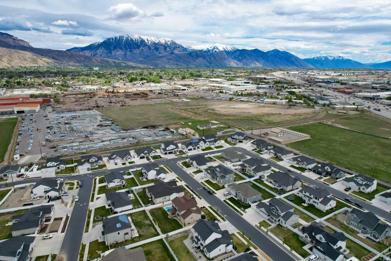 Aerial view of residential area with a mountain backdrop