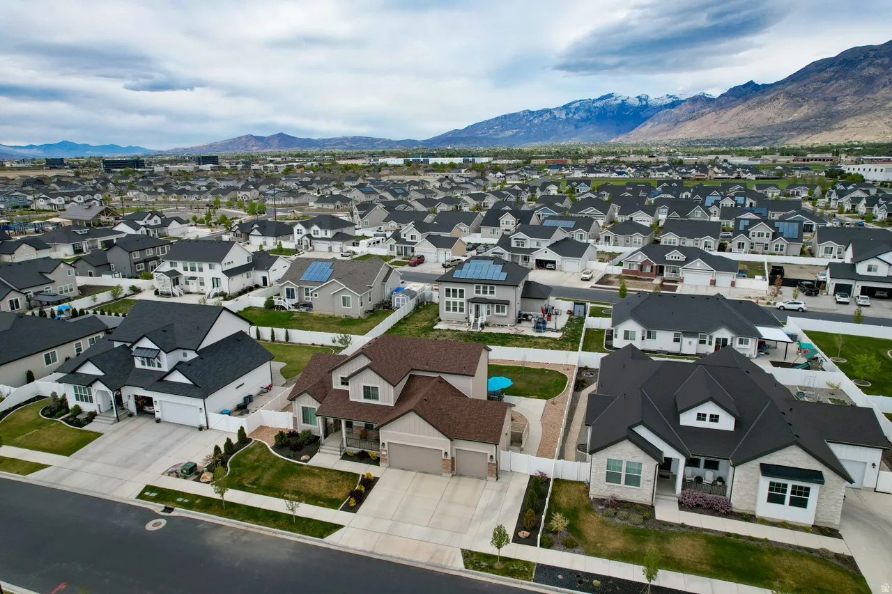 Aerial view of residential area with a mountainous background