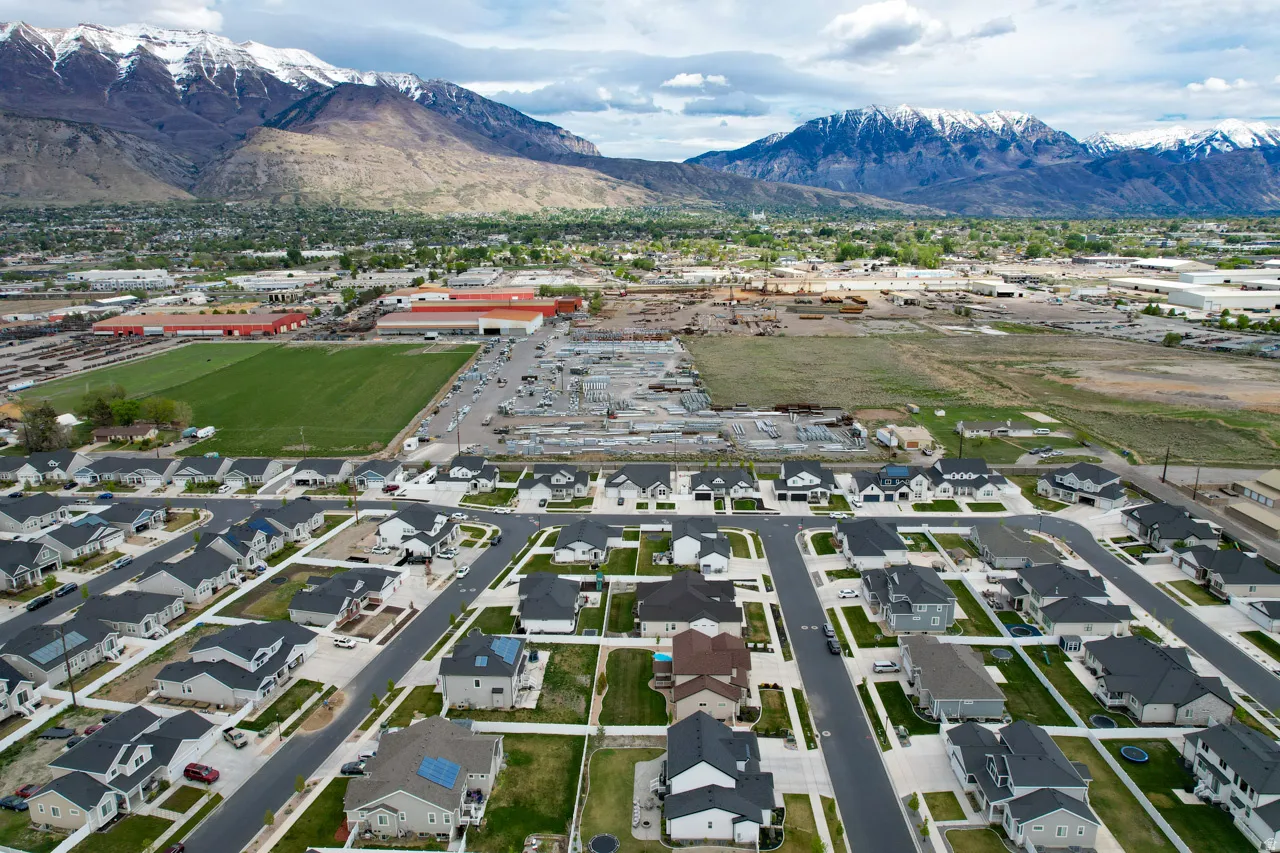 Aerial view of residential area with a mountainous background