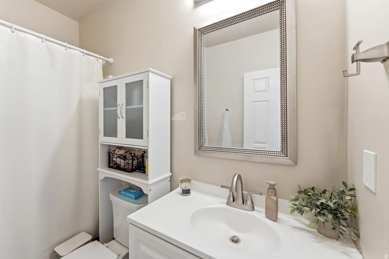 Bathroom with vanity and a shower with curtain