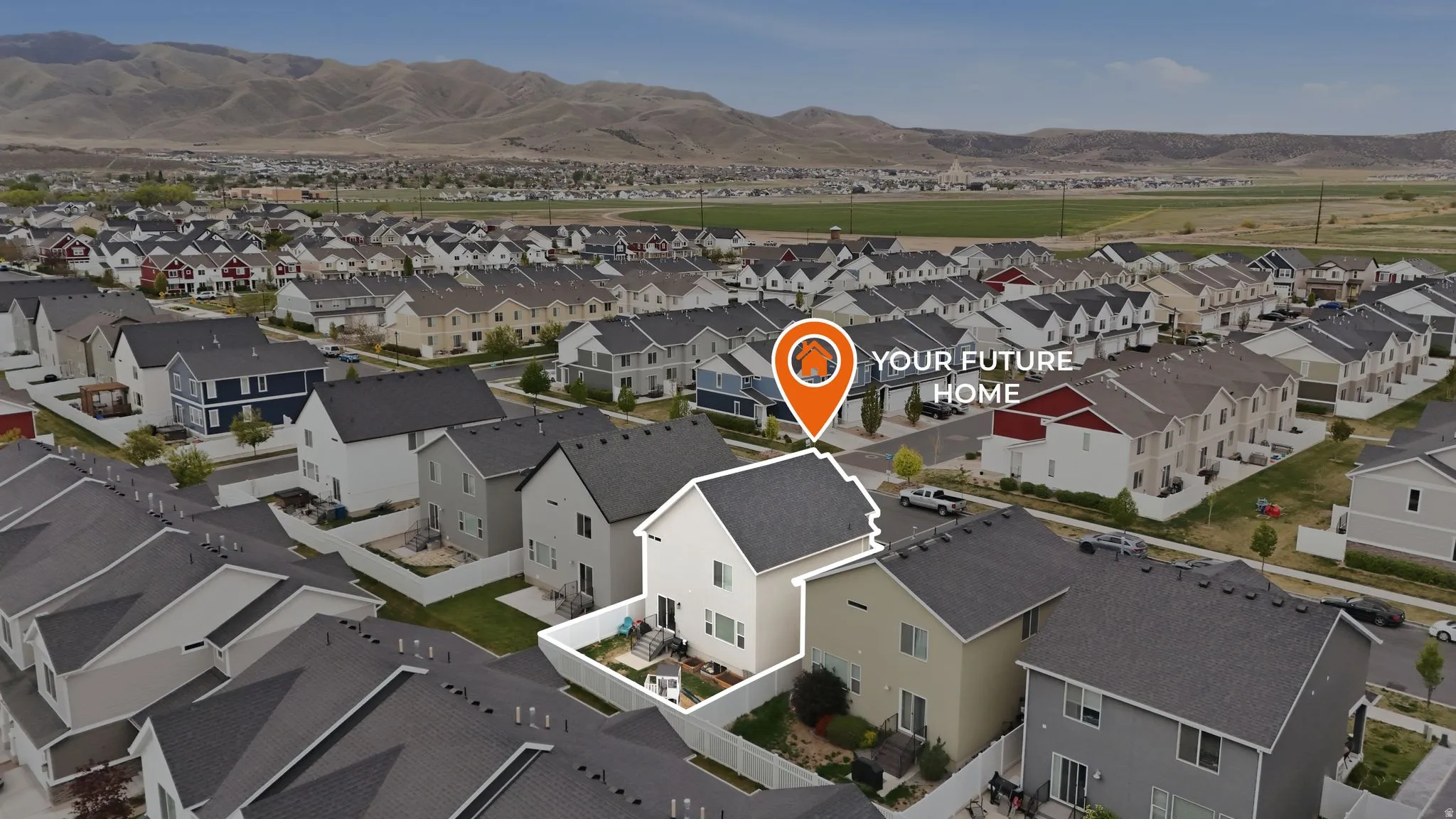Aerial view of residential area with a mountainous background