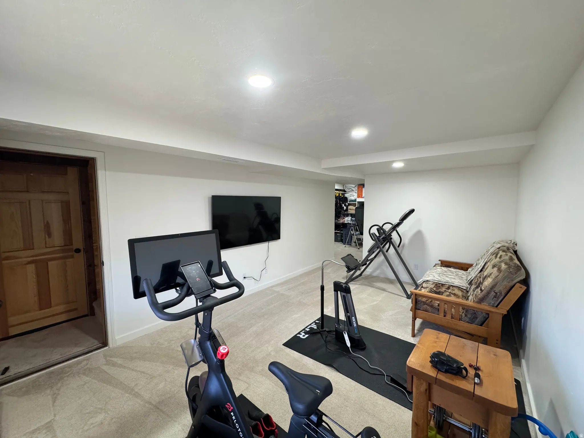 Exercise area with carpet floors and recessed lighting