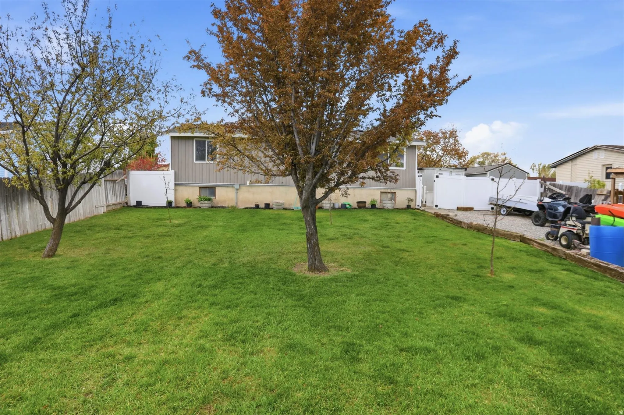 View of fenced backyard