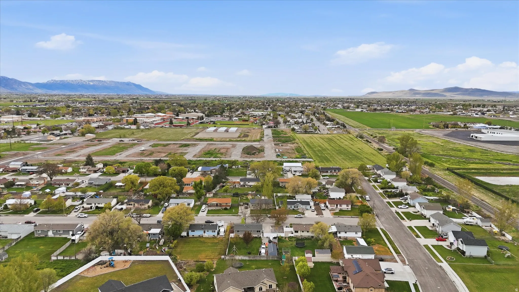 Aerial perspective of suburban area with a mountainous background