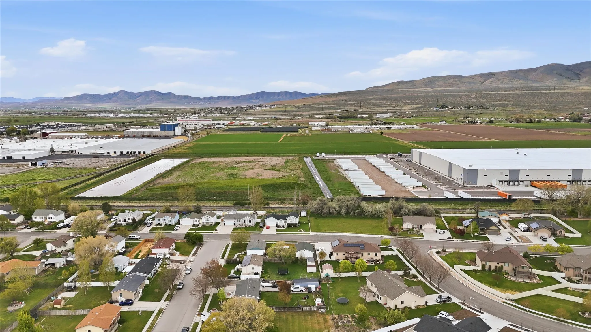 Aerial perspective of suburban area with a mountain backdrop