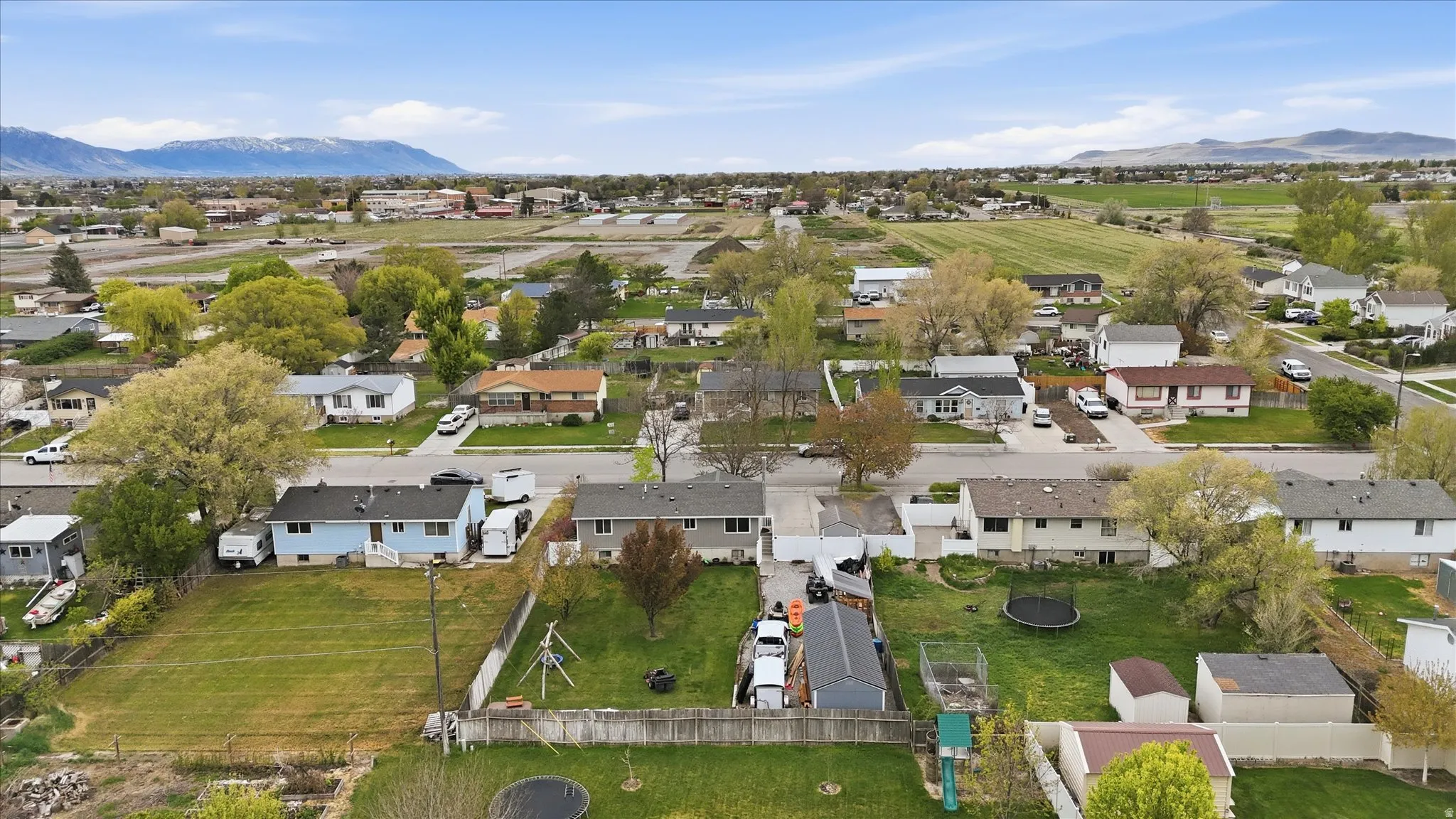 Aerial perspective of suburban area with a mountain backdrop