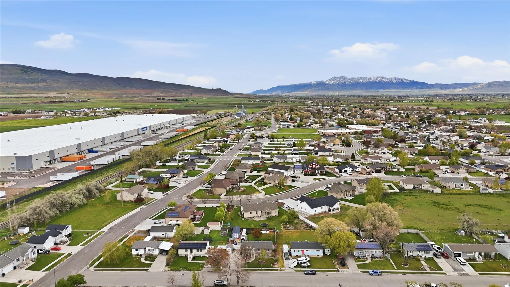 Aerial view of residential area with a mountainous background