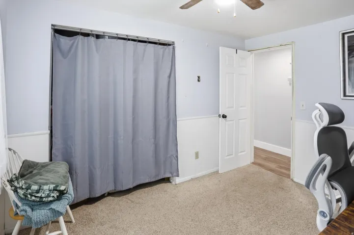 Bedroom with carpet and ceiling fan