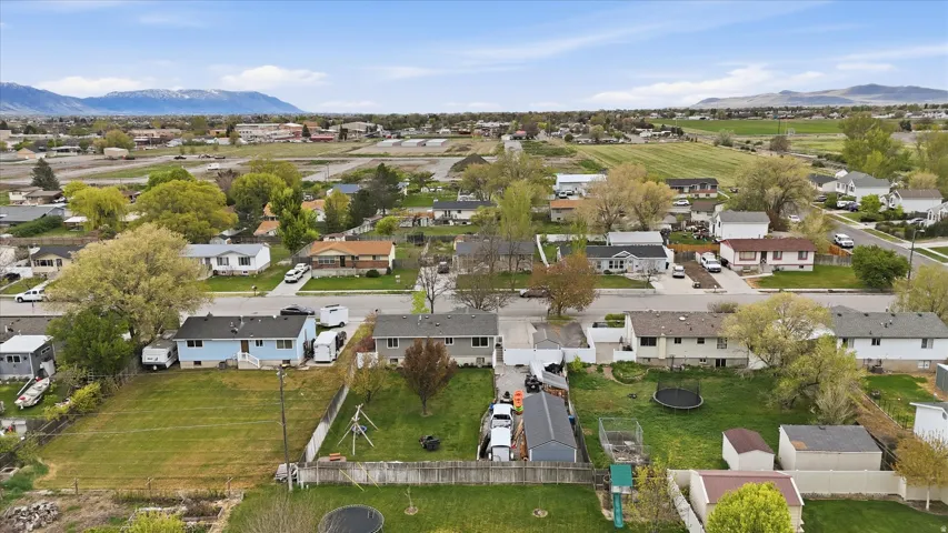 Aerial perspective of suburban area with a mountain backdrop