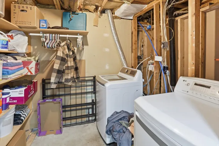 Laundry area featuring washing machine and clothes dryer