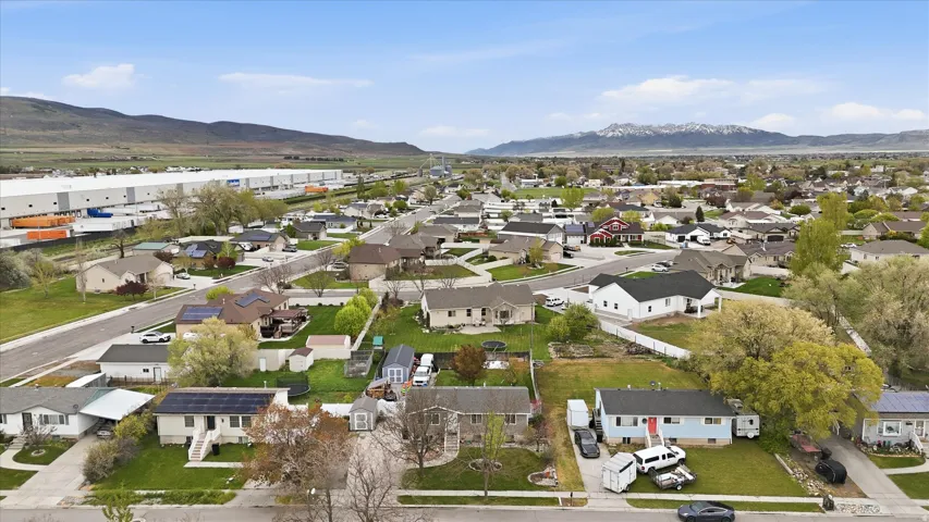 Aerial perspective of suburban area with a mountain backdrop