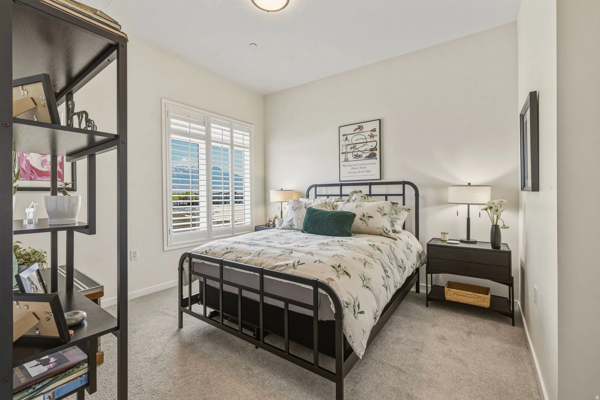 Bedroom featuring light carpet
