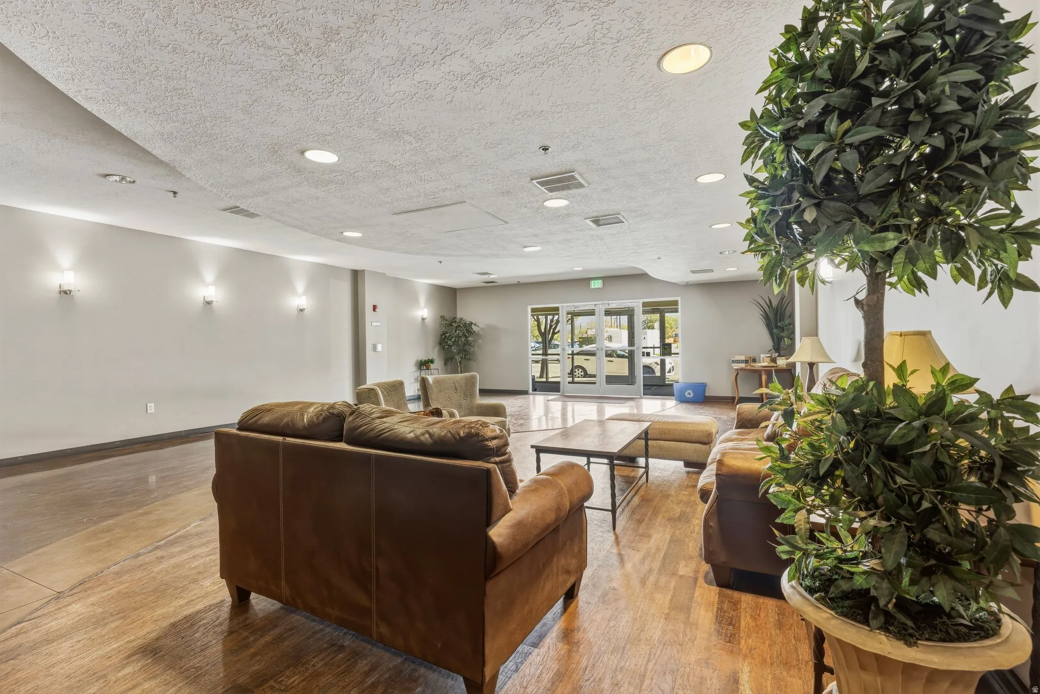 Community lobby featuring a textured ceiling and recessed lighting