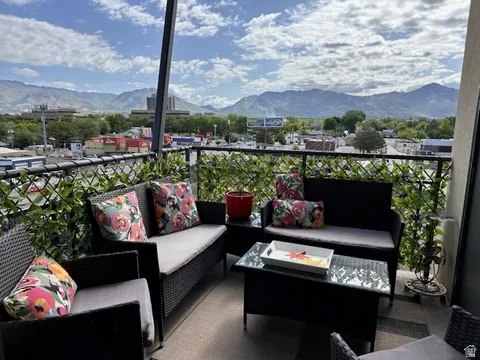 Balcony featuring a mountain view and outdoor furniture