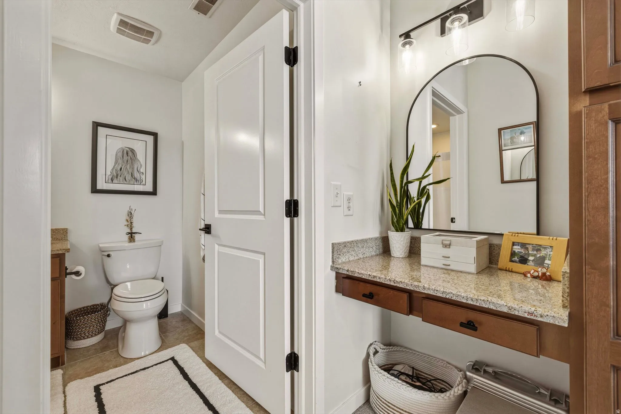 Bathroom featuring vanity and light tile patterned floors