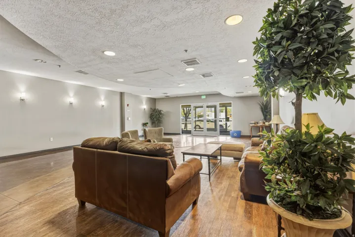 Community lobby featuring a textured ceiling and recessed lighting