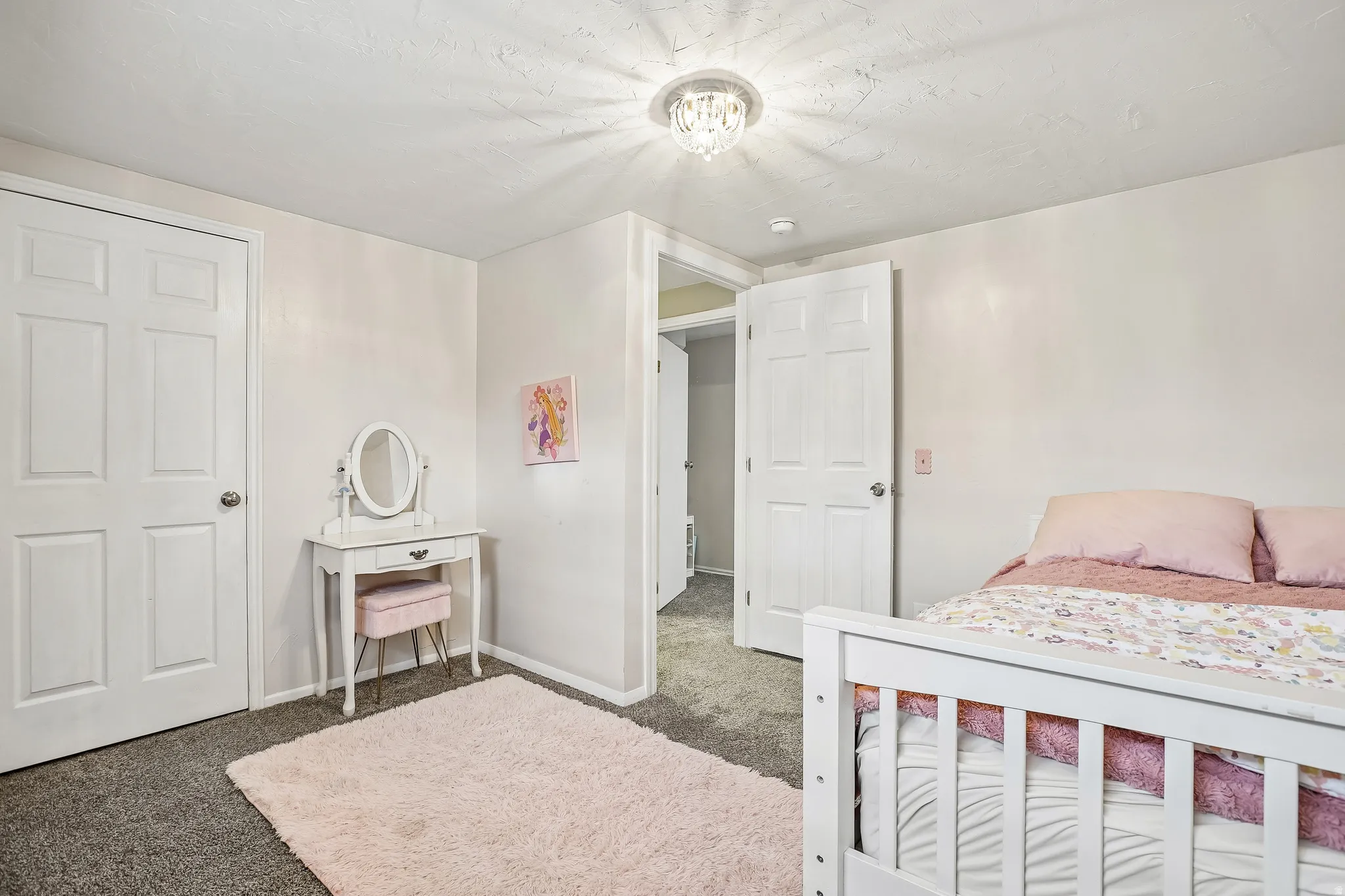 Carpeted bedroom with baseboards