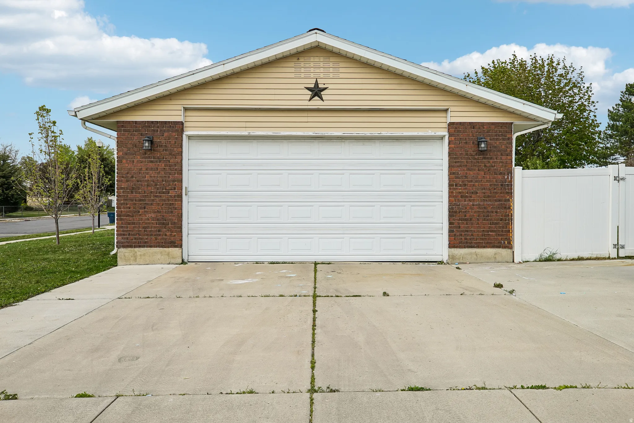 Garage featuring driveway