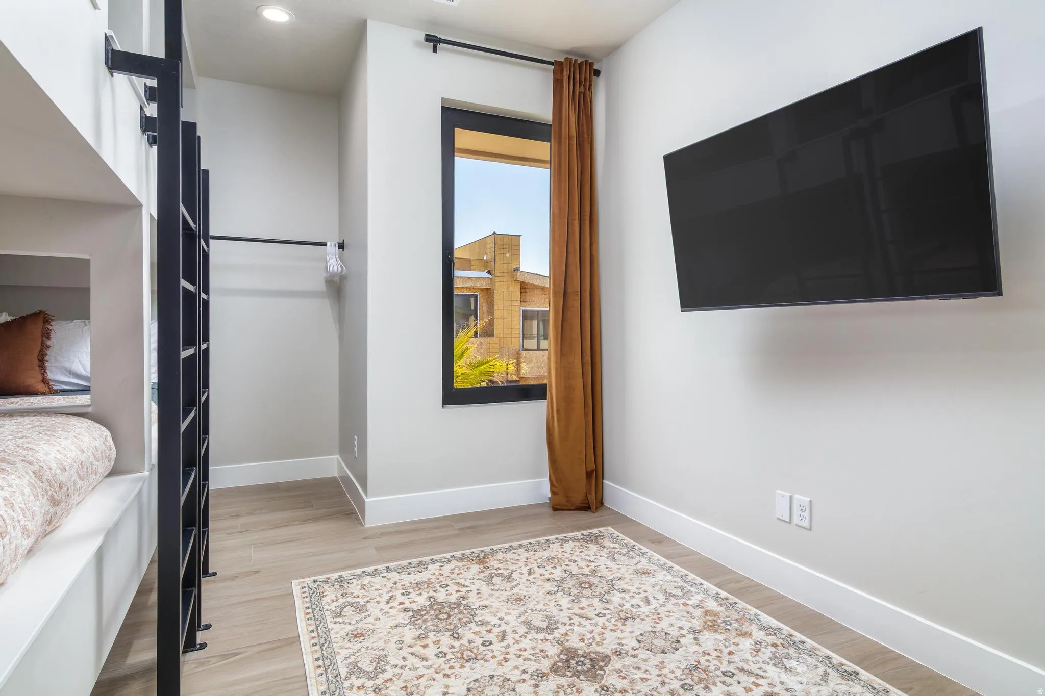 Bedroom with baseboards and light wood-style flooring