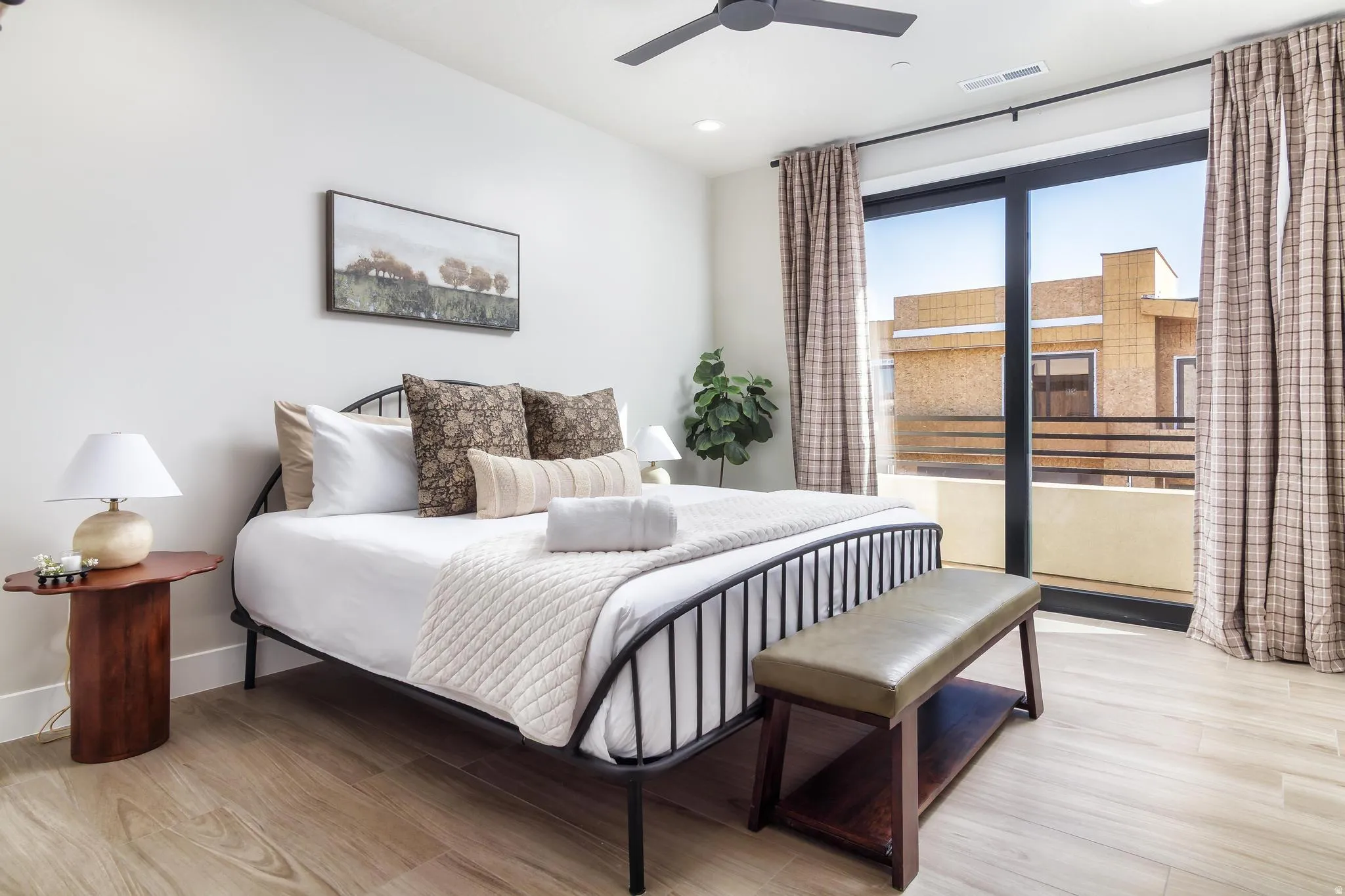 Bedroom featuring light wood-type flooring, a ceiling fan, and recessed lighting