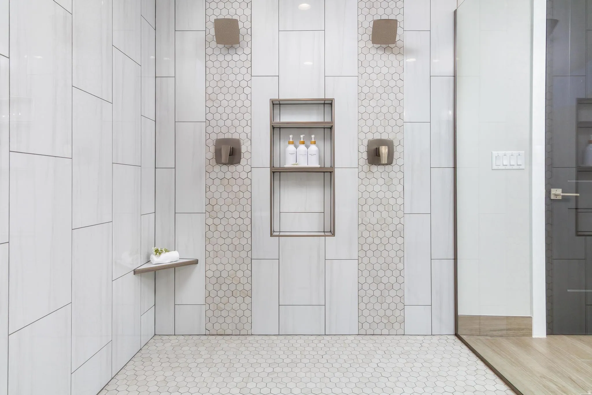 Full bath featuring a tile shower
