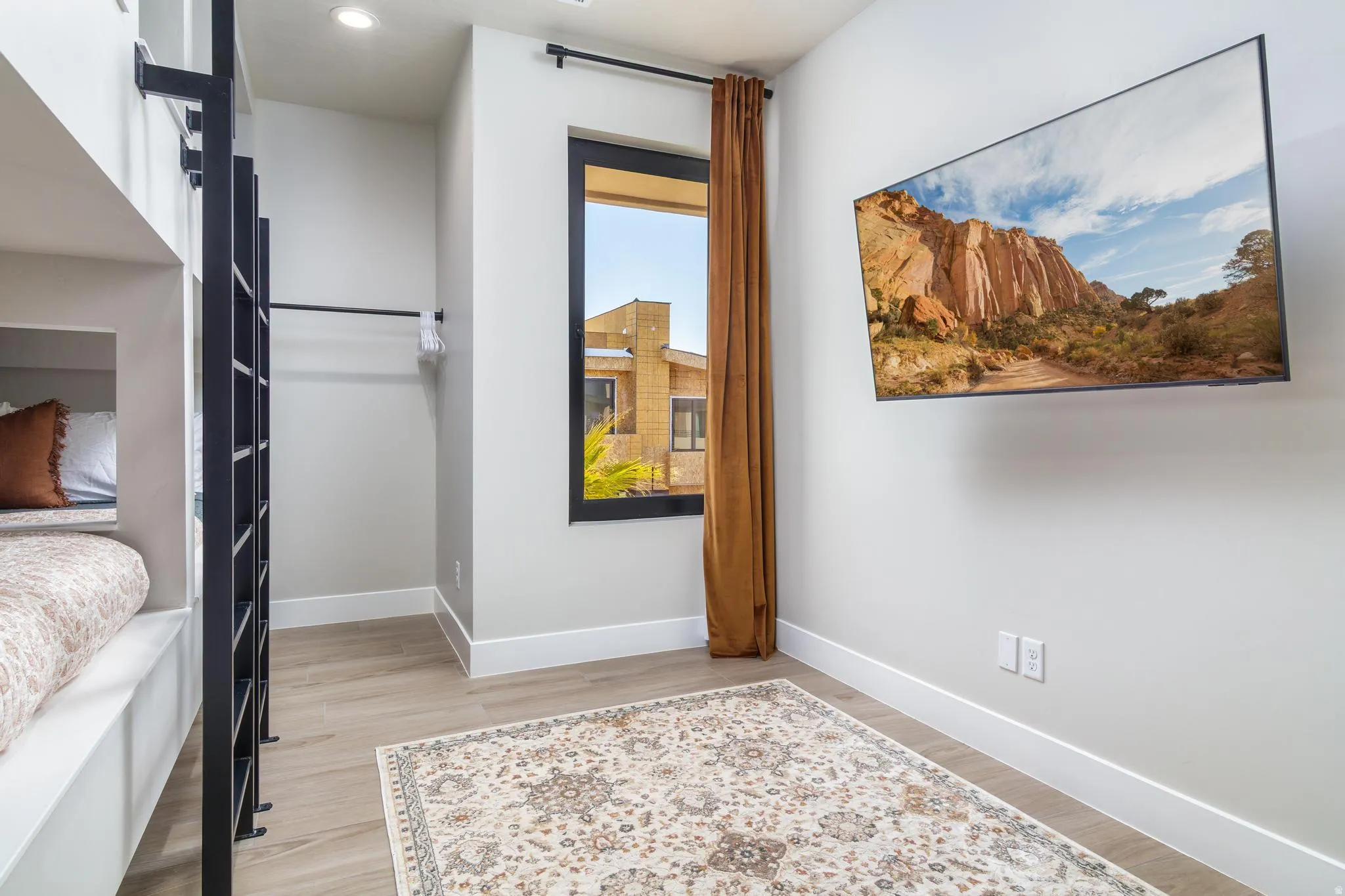 Bedroom with baseboards and light wood-style floors