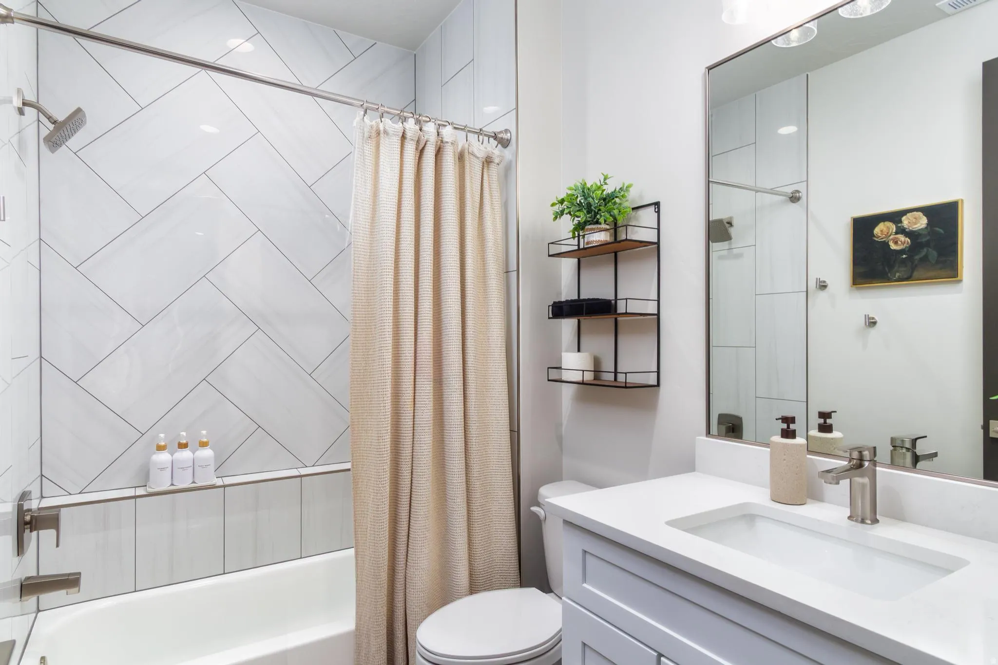 Bathroom with vanity and shower / bath combo