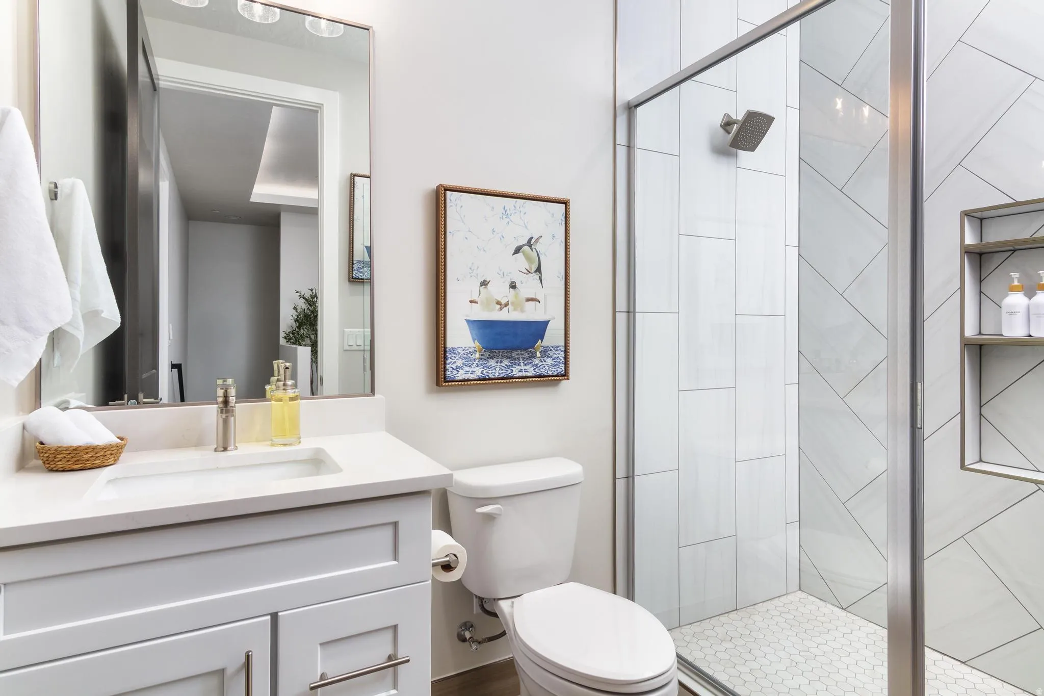 Bathroom featuring vanity and a stall shower