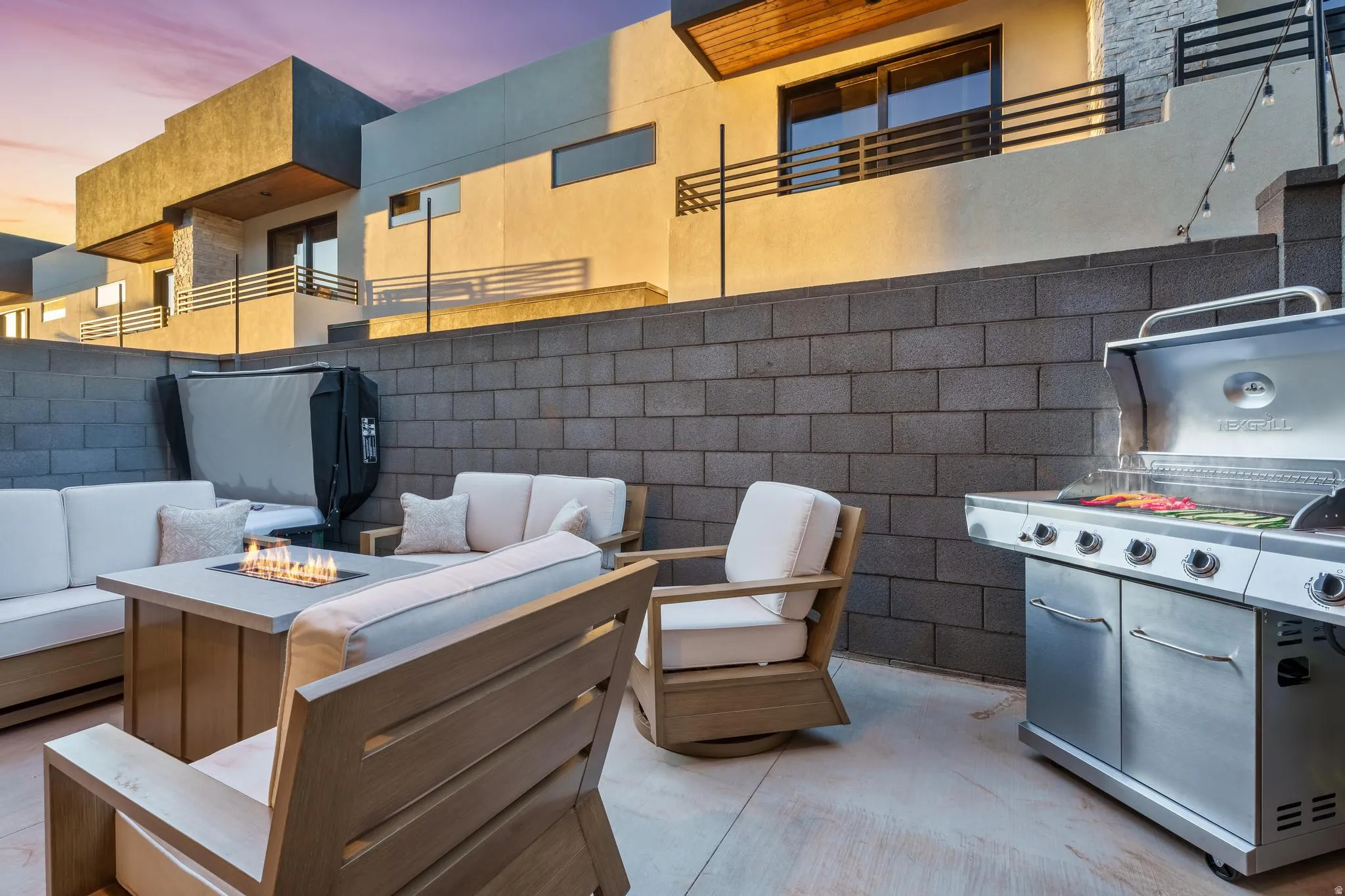 View of patio / terrace featuring grilling area and an outdoor living space with a fire pit