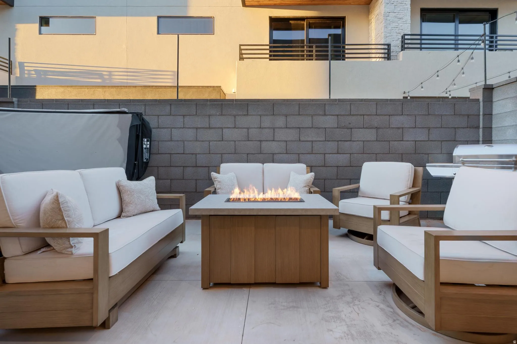 View of patio with an outdoor living space with a fire pit