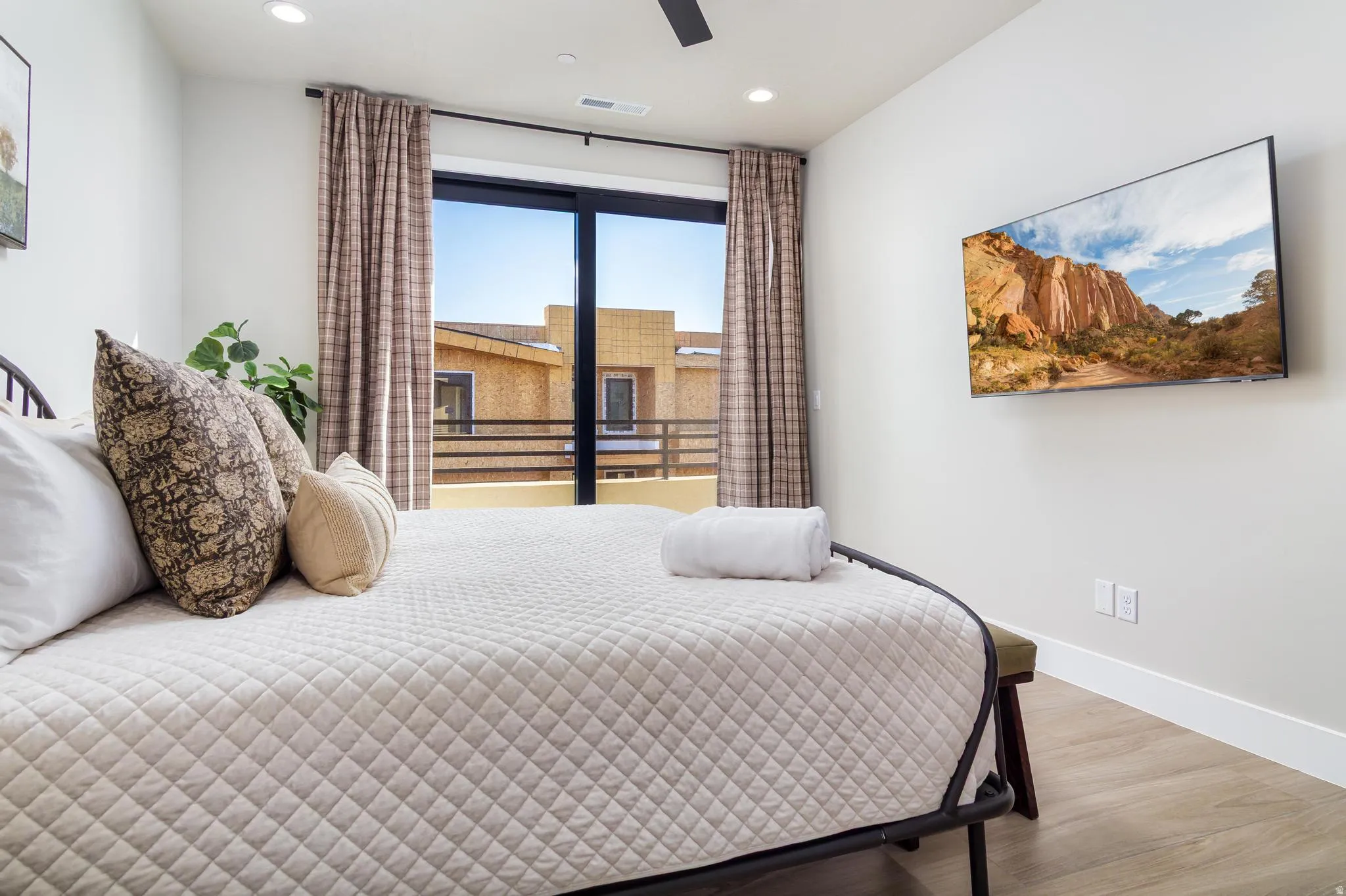 Bedroom featuring wood finished floors, recessed lighting, and a ceiling fan