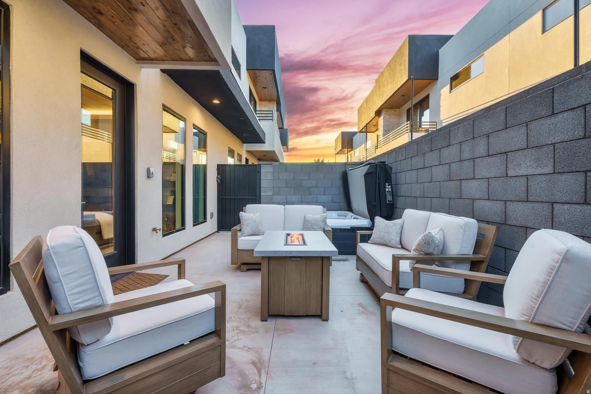 View of patio featuring an outdoor living space with a fire pit