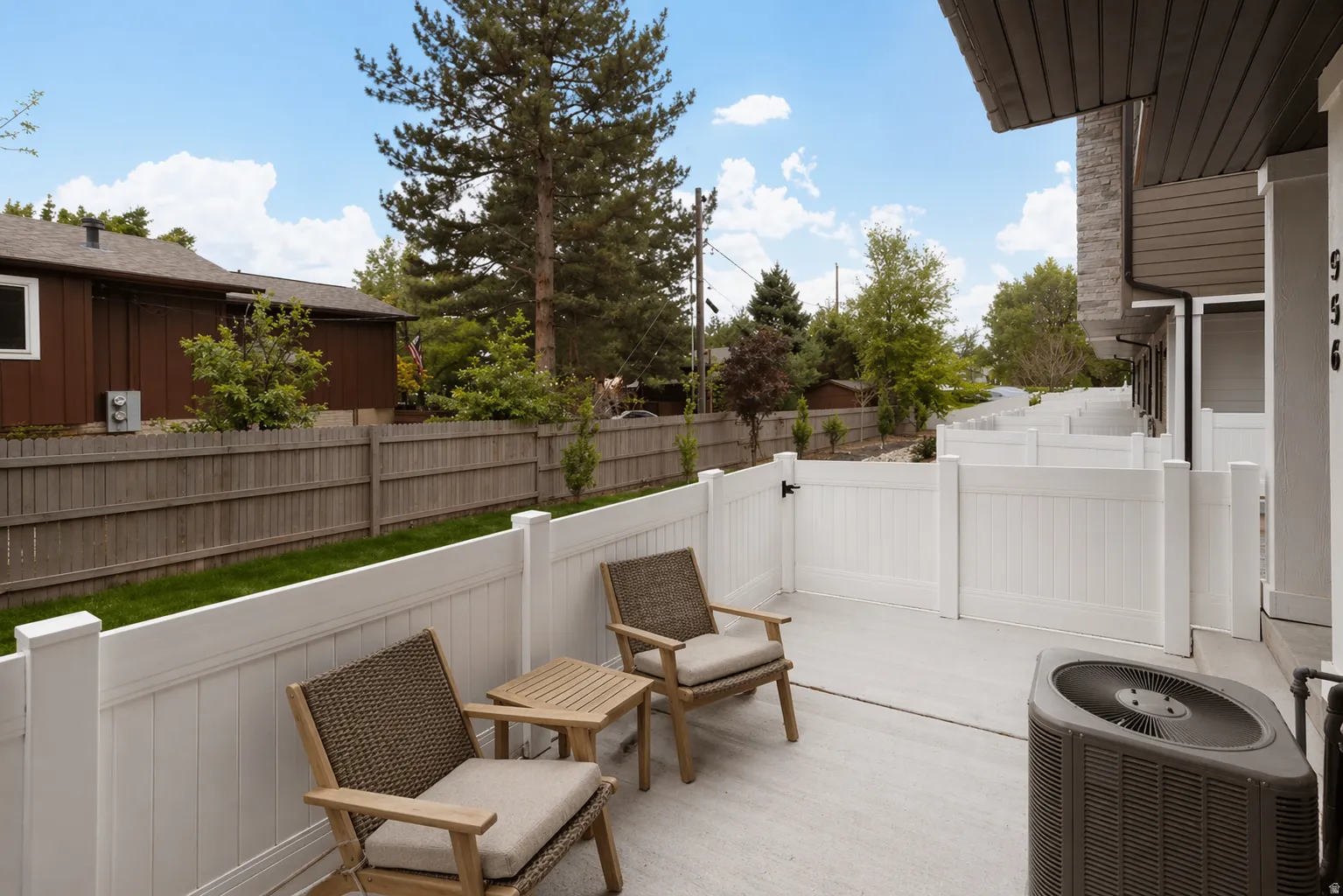 Fenced backyard with a patio area