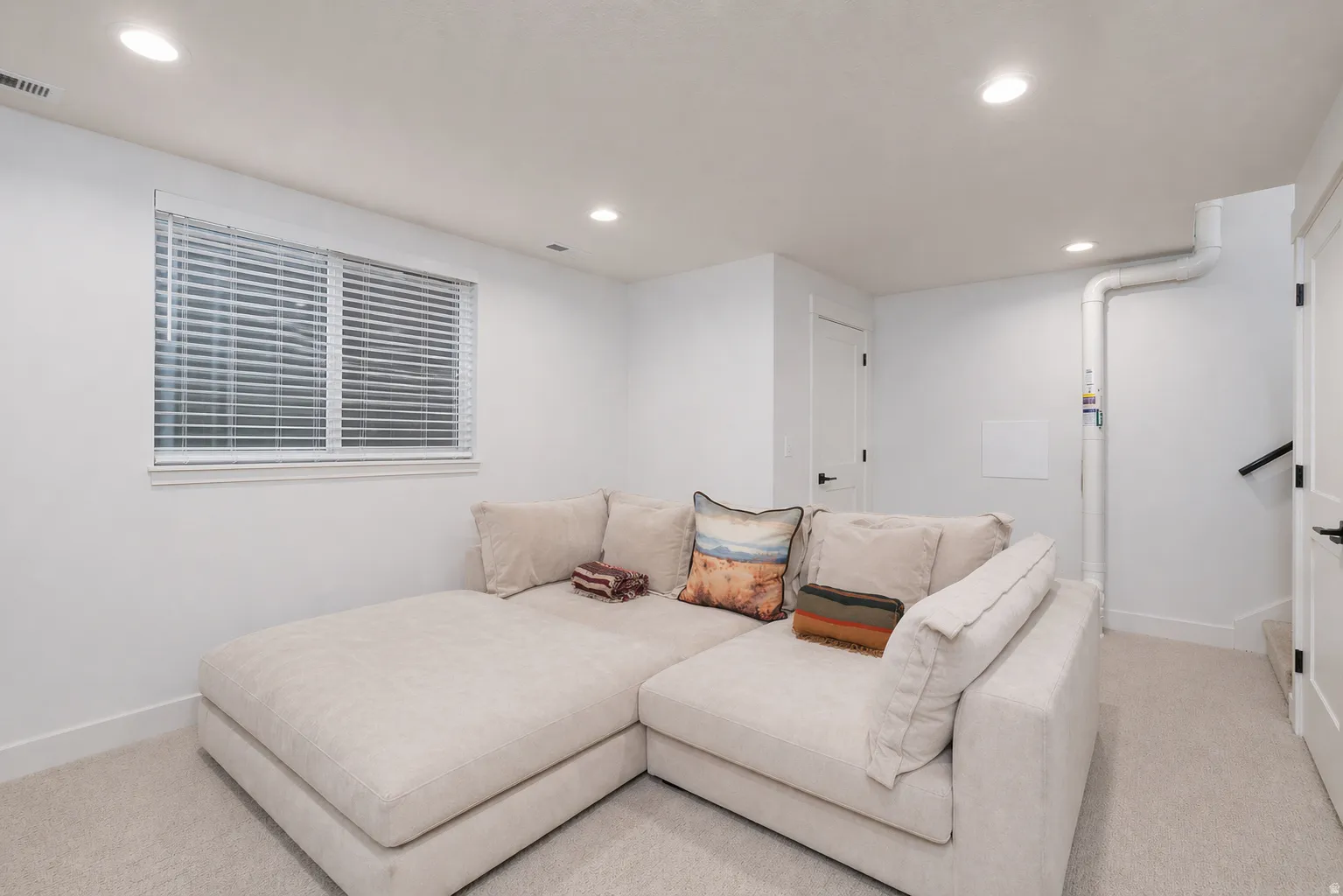 Living room featuring recessed lighting and carpet